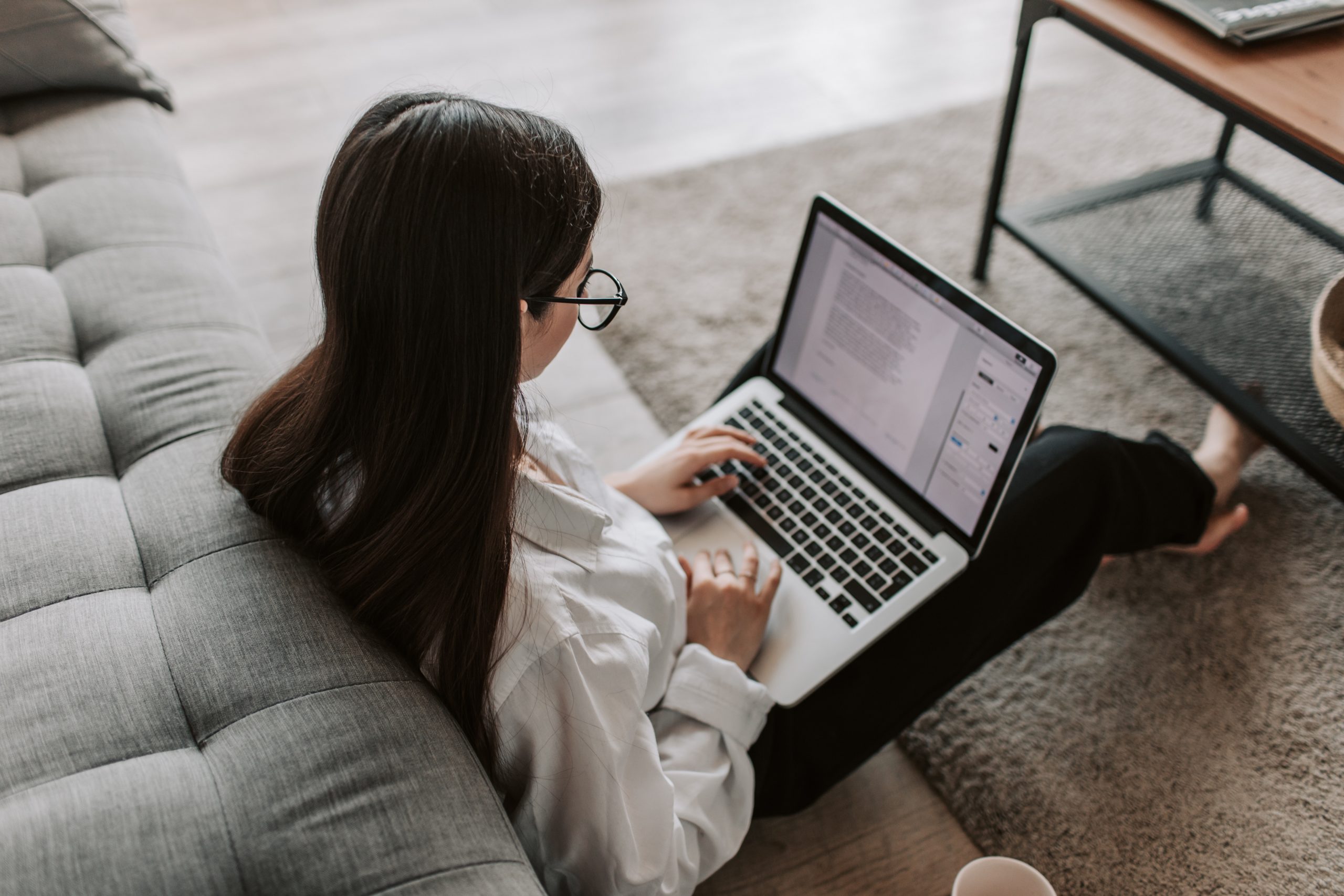Woman working at home using her laptop